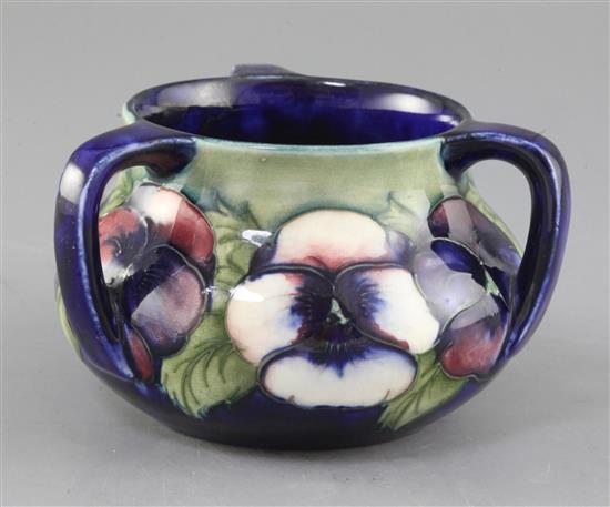 A Moorcroft pansy pattern three handle vase, second quarter 20th century, height 9cm width 14cm